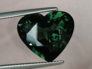14.25 carats heart shape green sapphire nicely cut and perfectly clean. 