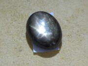 Black Star Sapphire in oval shape cabochon. 