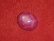 Star Ruby cabochon pink and red with typical corundum crystal pattern