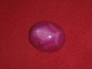 Star Ruby cabochon pink and red with typical corundum crystal pattern