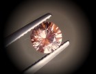 Precision 6.5mm brilliant cut orange to salmon zircon, perfectly cut from professional lapidary. 